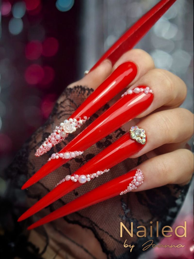 Red stiletto nails with rhinestones