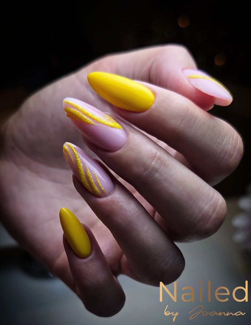 Yellow nails with gold lines